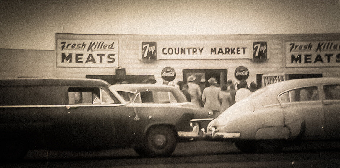 Black and White photo of the Country Market original location with cars out front