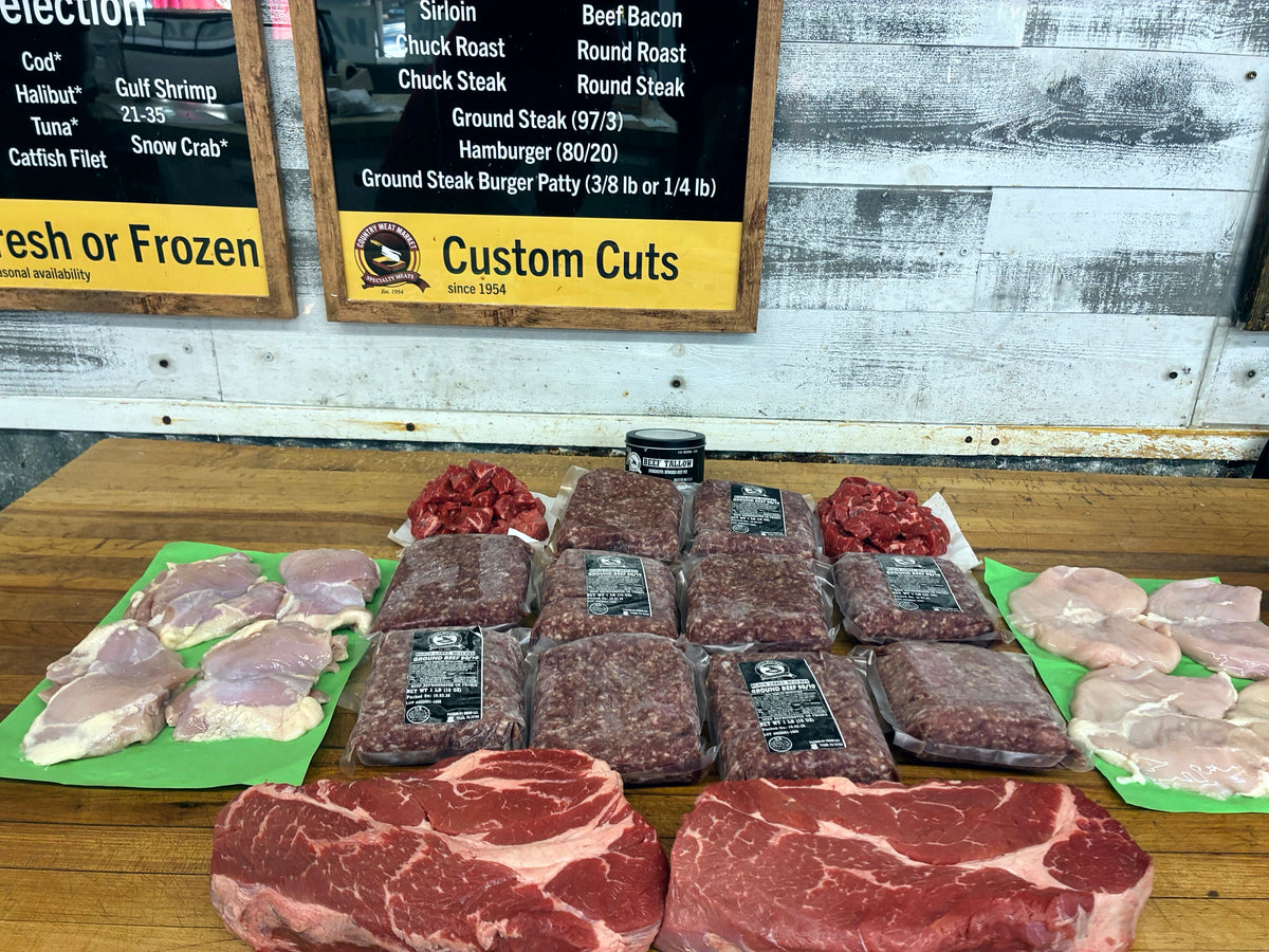 Ground beef, stew meat and beef cuts on the butcher block at Country Meat Market