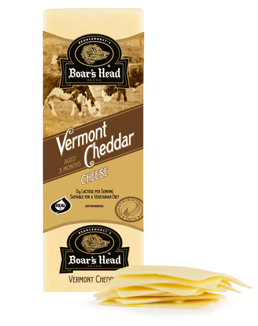 Boar's Head Vermont Cheddar cheese block packaging shown upright with several sliced cheese wedges placed in front on a white background.