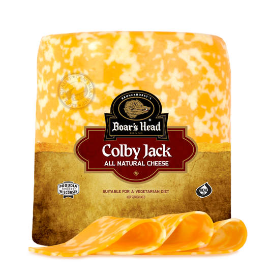 A large block of Boar's Head Colby Jack cheese with several slices cut and arranged in front, photographed on a clean white background.