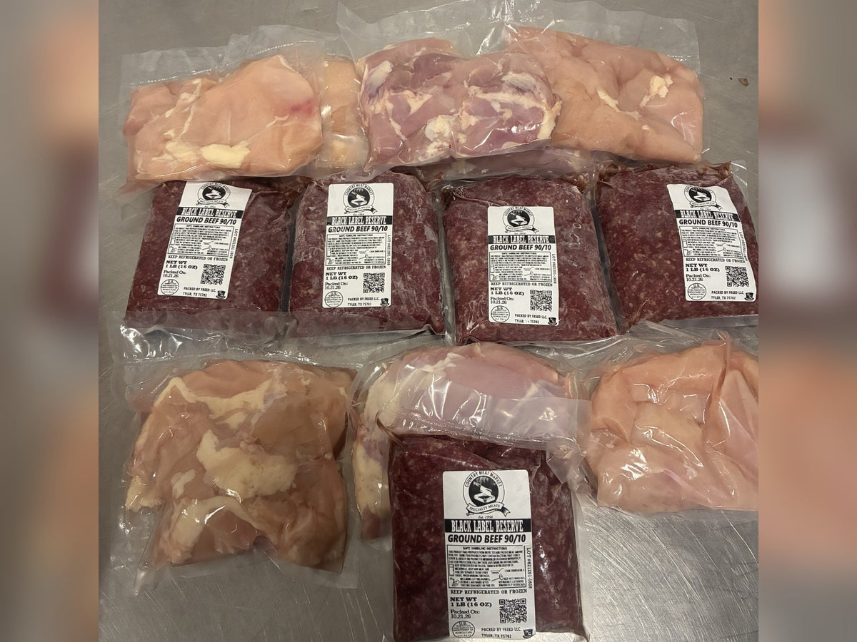Freezer Filler Box laid out: 5 packs of 90/10 lean ground beef plus chicken breast and thigh packs